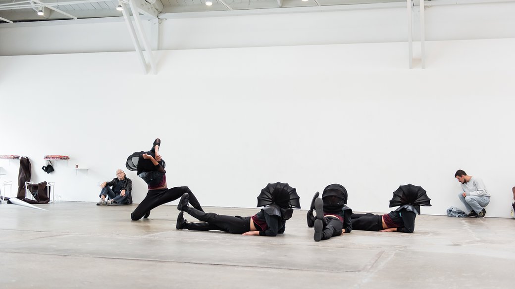 Four dancers at CCA's Wattis Institute performing Adam Linder Full Service Leah Katz, Justin F. Kennedy, Noha Ramadan, and Stephen Thompson