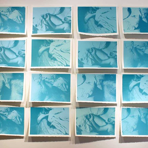 Multiple screen prints in blue of an infant sleeping.