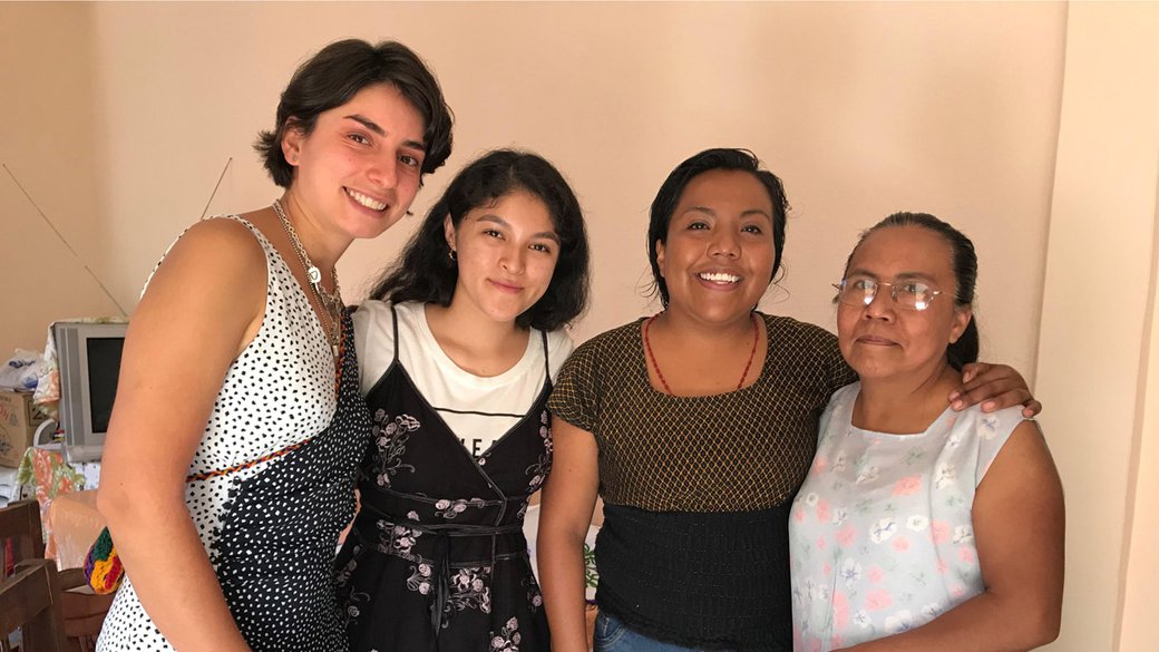 CCA students Yesenia Villaseñor and Sajida Silva pose with Oliva and her daughter Veronica