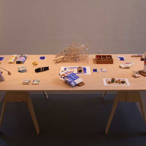 View of artwork set on table as part of the BFA exhibition installation.
