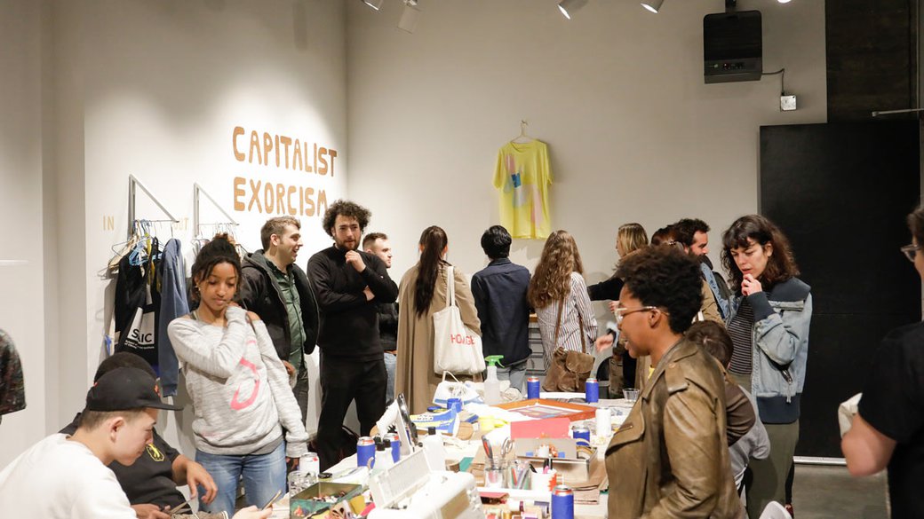 CCA fine arts students lead a "Capitalism Exorcism" activation in the Hubbell Street Galleries