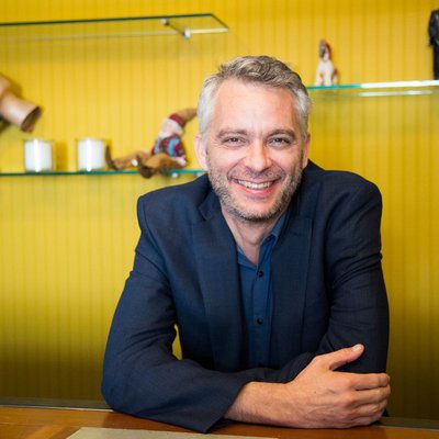 Anthony Huberman at the Wattis Bar—a casual, social space where community gathers.