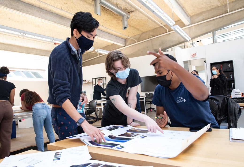 students collaborate on an architecture project in the studio
