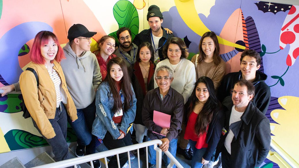 mural creation class poses in front of their work at the Children's museum at YBCA