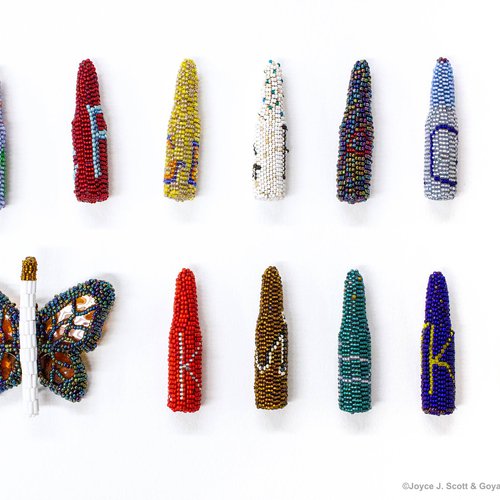 Joyce J. Scott, Excessive Force, 2018. Beads, thread, found object, dimensions variable, bullets: 2 7/8 x 3/4 x 3/4 inches each,  butterfly: 3 1/2 x 3 1/4 x 1 1/4 inches.