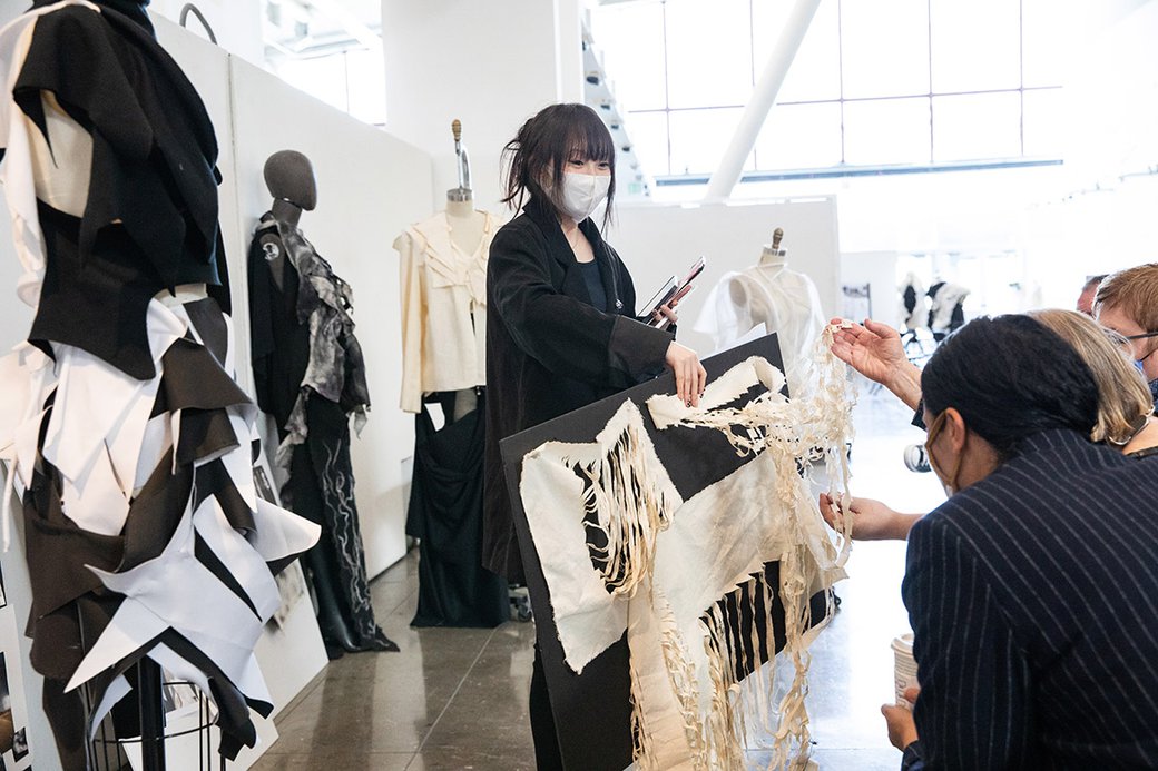 Fashion students meeting with industry professionals for review