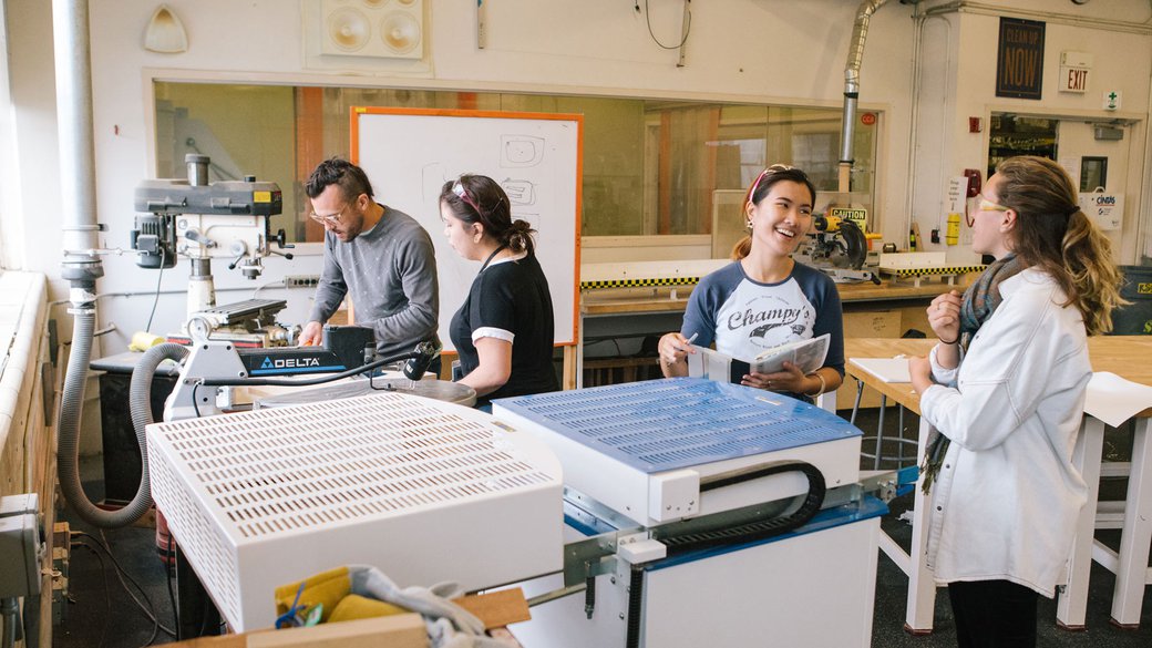 Photograph of students using equipment in the First Year Studios Wood Shop.