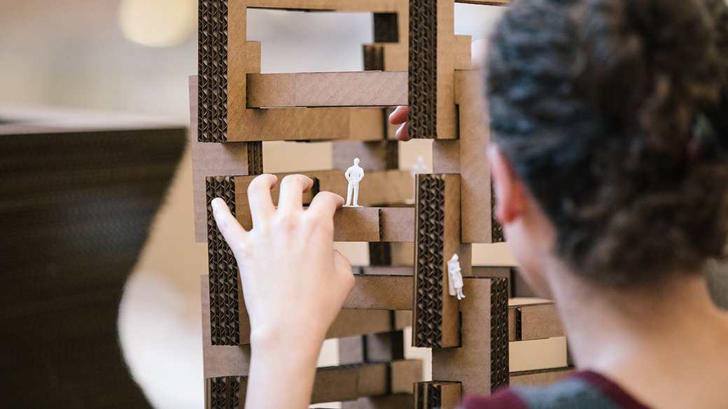 CCA architecture student working on model made from cardboard