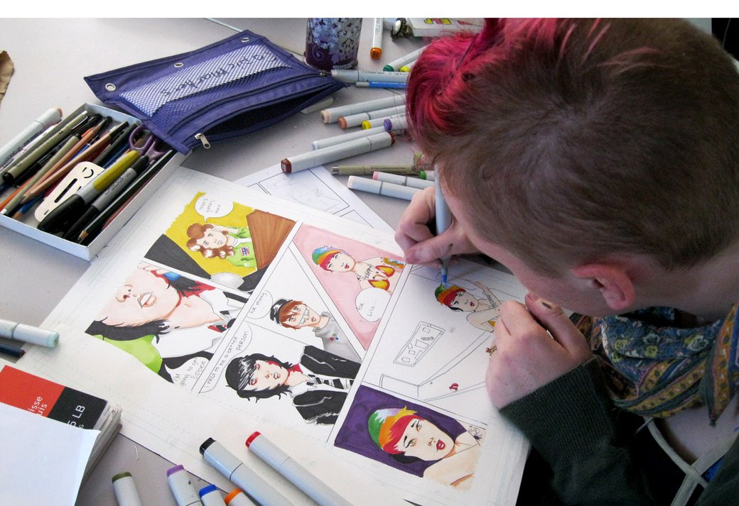 Summer Atelier student working on some colorful comics
