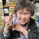 Oriental Art Gallery proprietor Su Lee displays one of her many pins.
