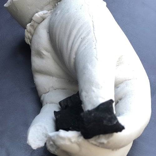 Loulou Evans, The Home I’m Holding: Wildfire victims of the Northern Bay Area hold remnants of their destroyed homes, 2021. Plaster, ash, and dirt.