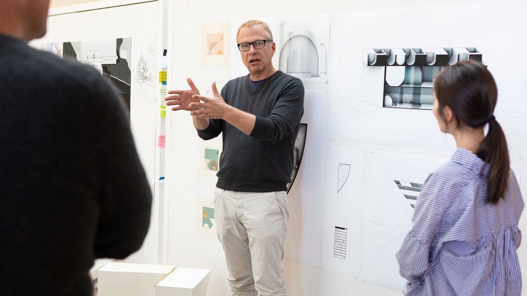 Keith Krumwiede speaking to students during M'Arch critiques.