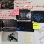 Whiteboard with notes in red ink, pictures, and post-it notes.