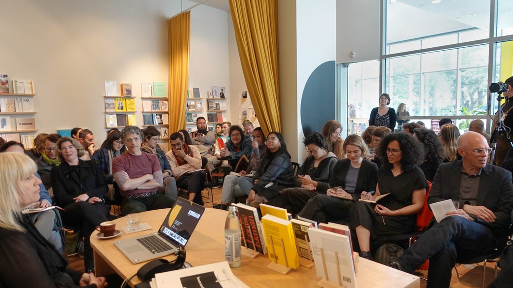 Maria Lind speaks to an assembled group at the Curatorial Research Bureau