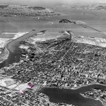 Aerial view of Oakland and the San Francisco Bay looking west over Lake Merritt, c. 1934.