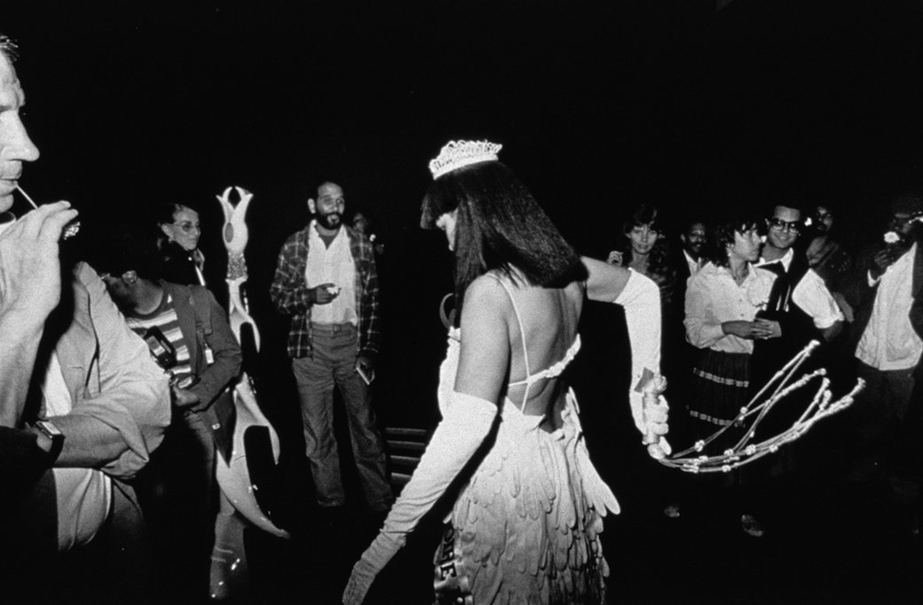Lorraine O’Grady, “Crowd Watches Mlle Bourgeoise Noire Shouting her Poem,” from Untitled (Mlle Bourgeoise Noire) 1980-83/2009. Silver gelatin fiber print, part 11 of 14, 8.13 x 10.62 in (20.65 x 26.97 cm). Edition of 20 + 2 AP.