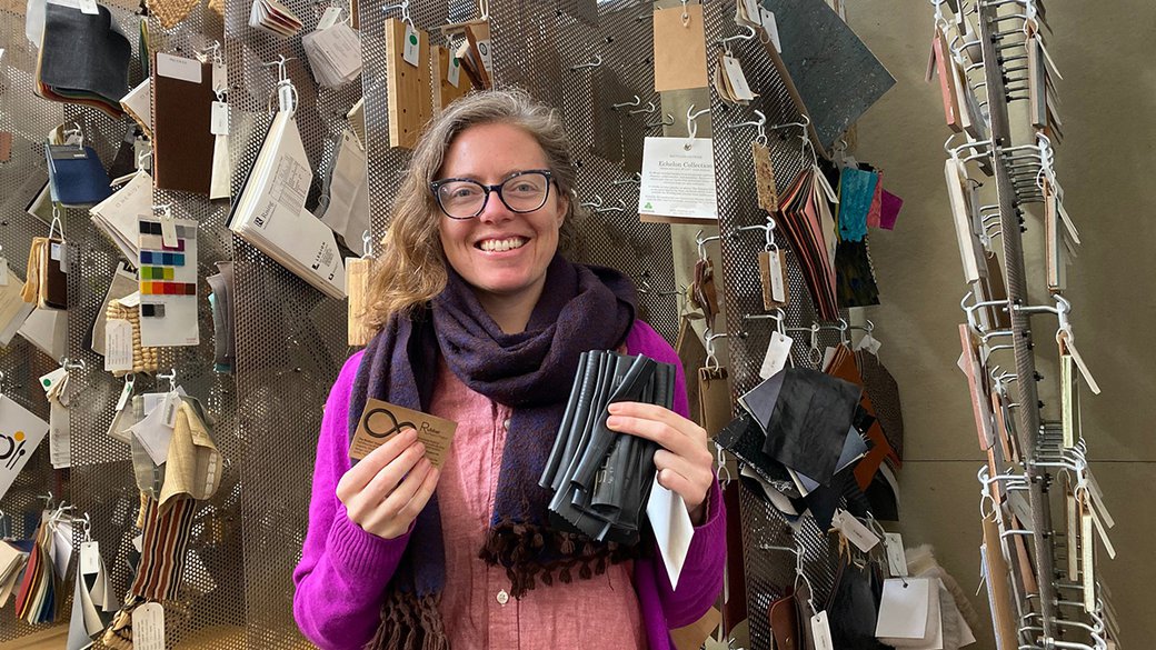 Librarian Erin Murray holds strips of inner tube rubber inside the CCA Materials Library.