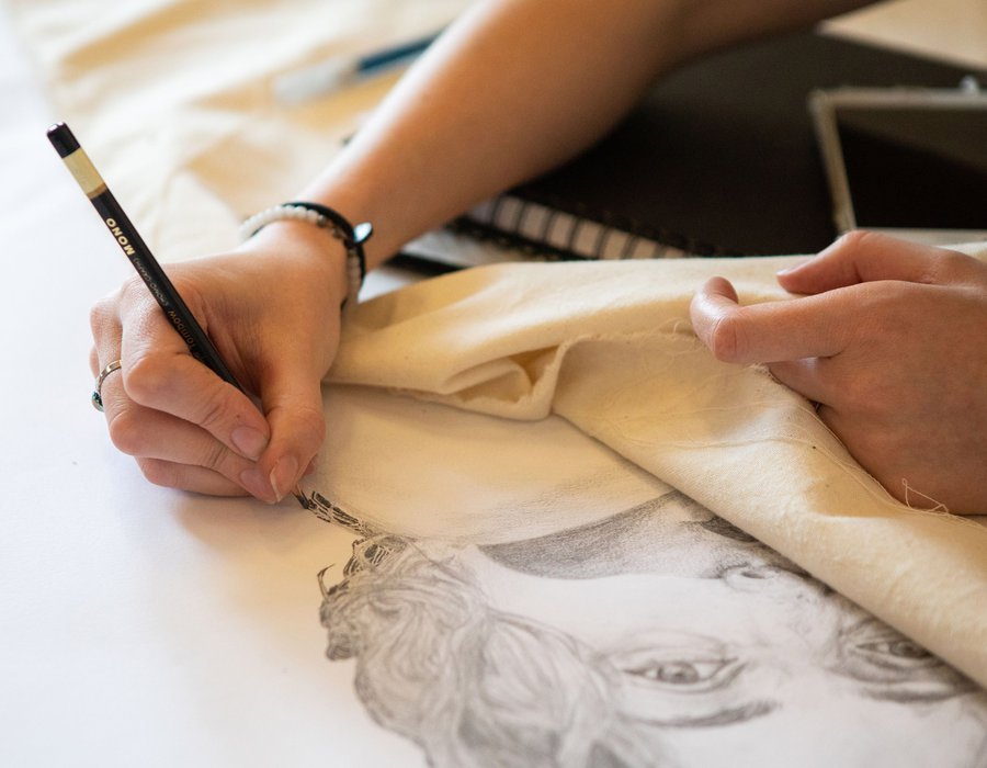 Natalia Poehner drawing a self-portrait in her studio