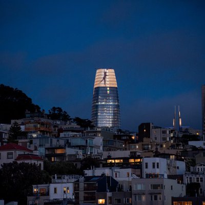 Figures dance across the crown of Salesforce Tower in San Francisco, as part of a light installation by artist Jim Campbell that premiered in May 2018.