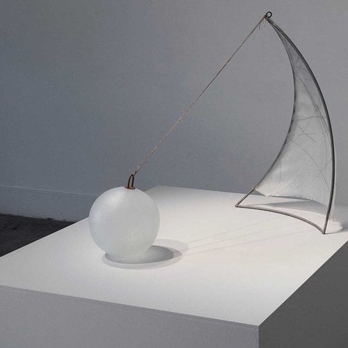 Glass artwork by Jordan Sitzer of floating ball and sail united by a rope.
