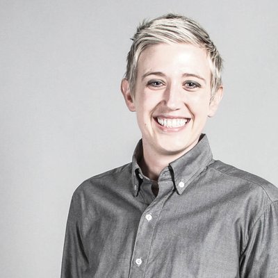 A headshot of Megan Moyer smiling into the camera.