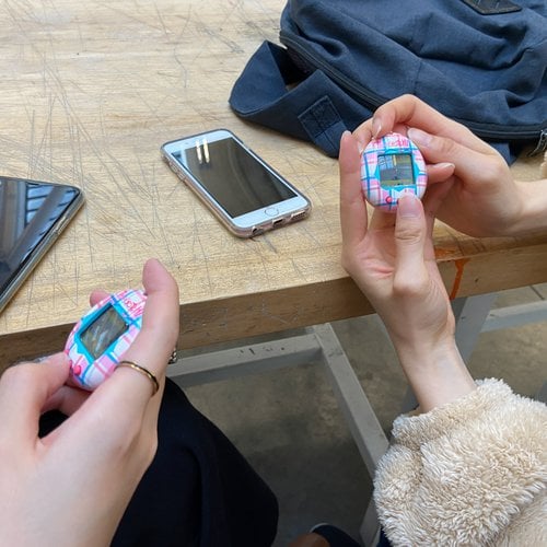 Students in Graphic Design 1 with Tamagotchi.