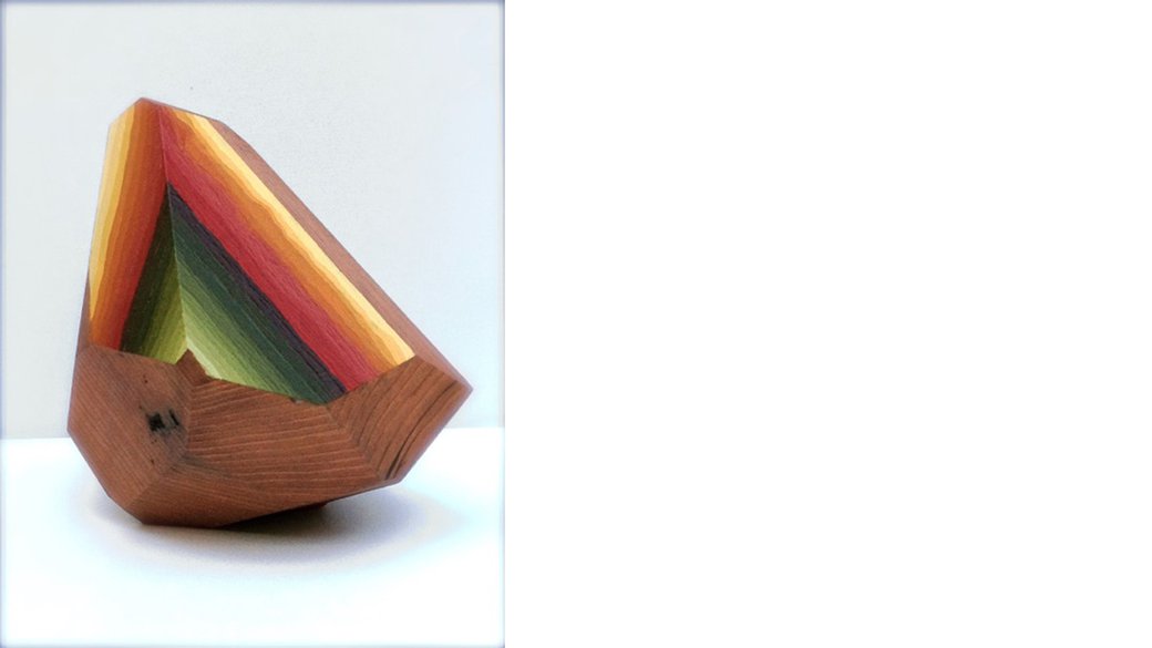Multicolored wood piece carved into the shape of a rock