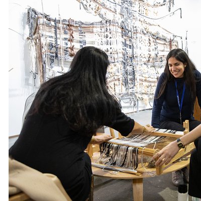 Kira Dominguez Hultgren leads a weaving workshop with fairgoers at Untitled, Art San Francisco in January 2020.