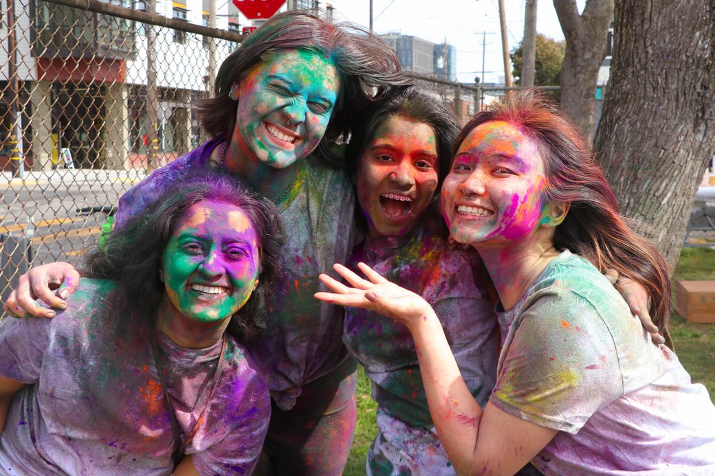 Students celebrating Holi at a nearby park