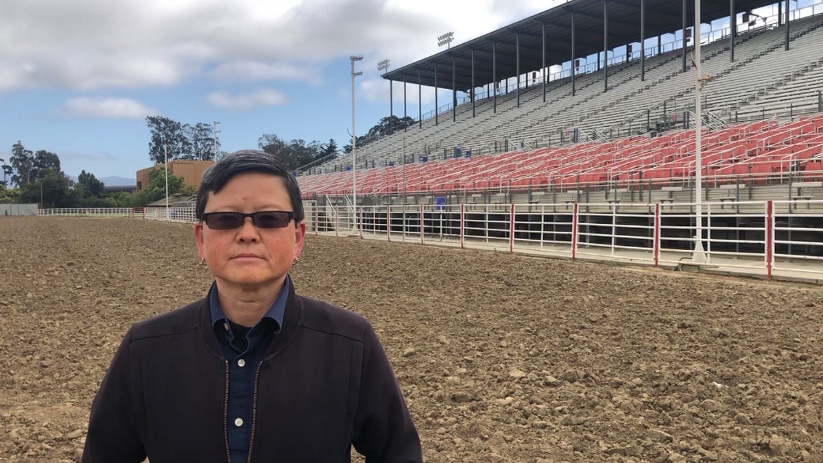 Tina Takemoto standing inside the Salinas Sports Complex for rodeos in Salinas, California