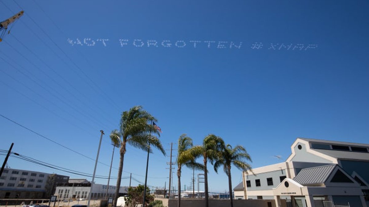 Skytyped message of the words Not Forgotten over Terminal Island in San Diego