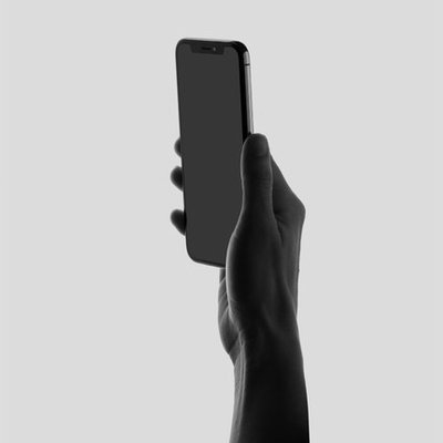 Image of hand holding a cell phone.