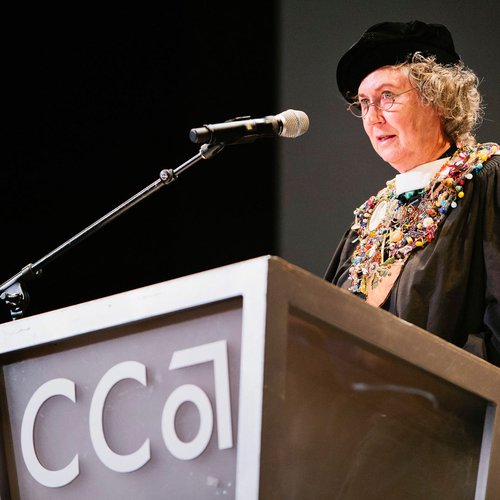 A speaker at a podium.