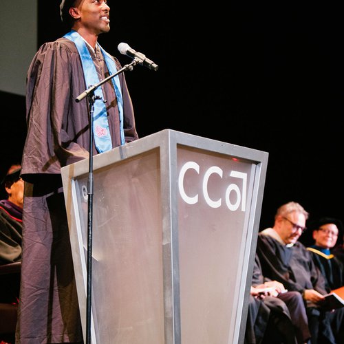 A speaker at a podium.