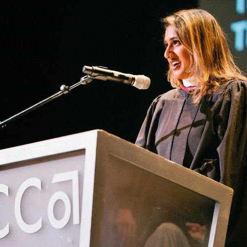A speaker at a podium.