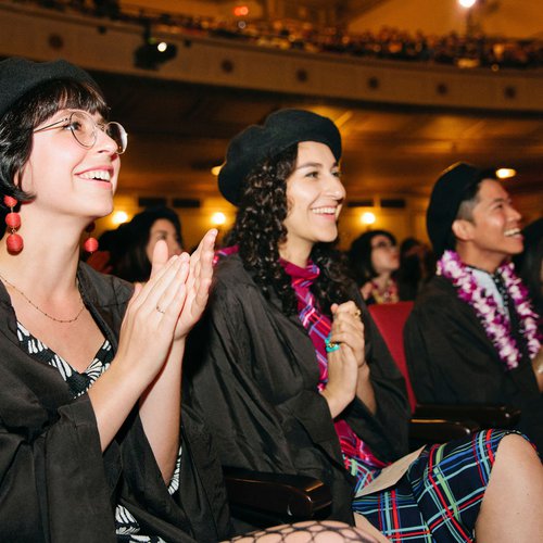 Students cheering for their friends during CCA's 2019 graduation ceremony.