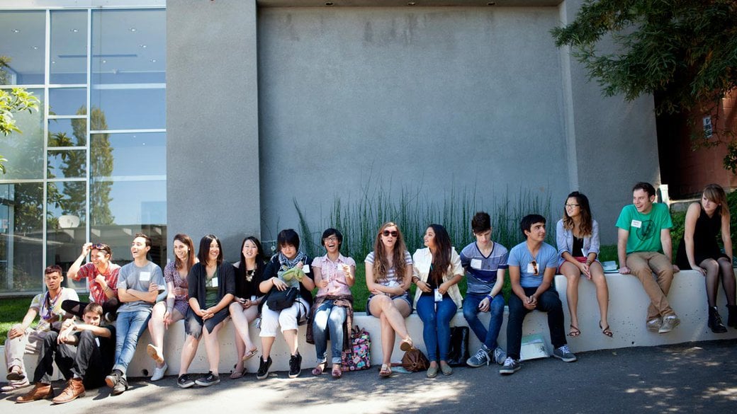 Undergraduate students sitting inside the Oakland campus