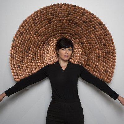 CCA Visiting Professor in the furniture Annie Evelyn in front of one of her designs.