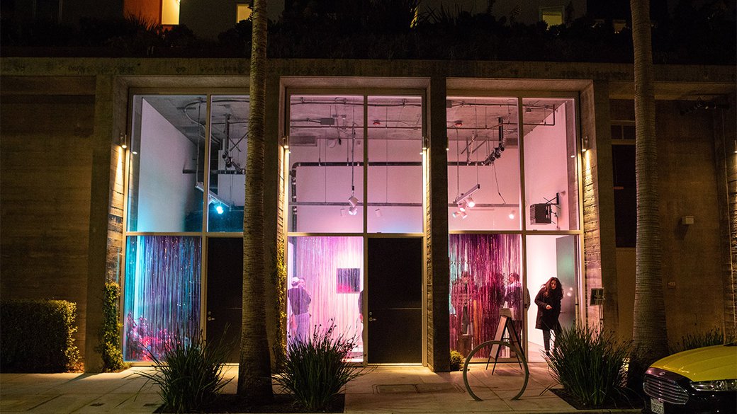 Exterior view of Playspace Gallery at night.