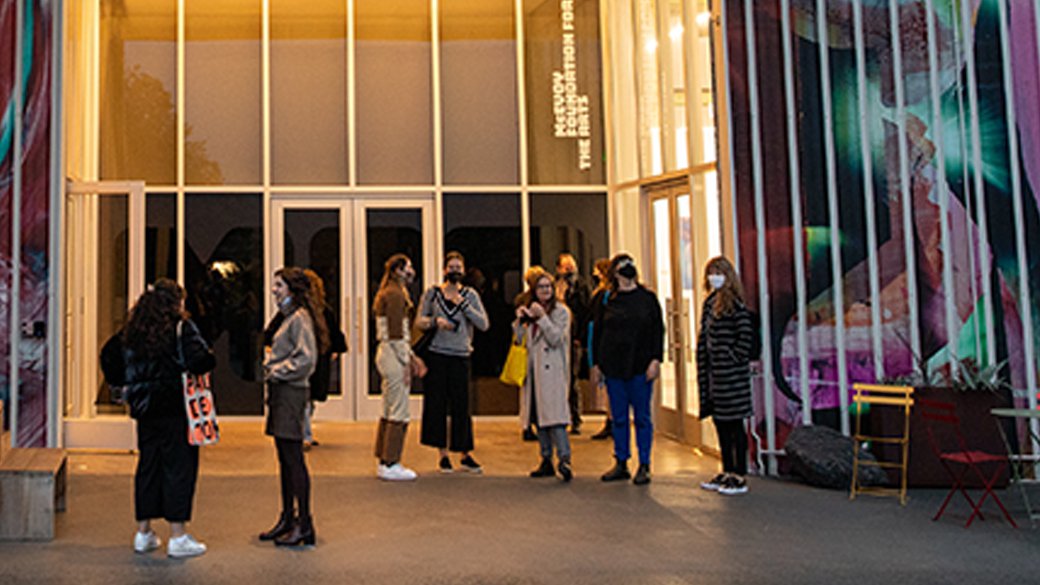 Curatorial practices students stand outside the entrance to Slash Art.