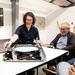 Photograph of MFA in Design student Sarah Bonnickson as she demonstrates her drawing machine.