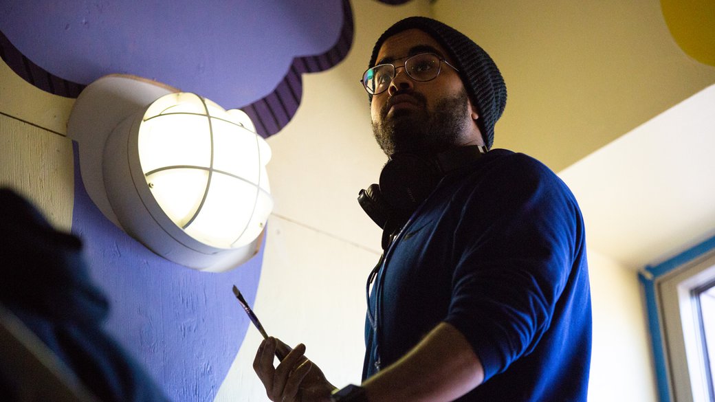 A students works on a mural at the Children's Creativity Museum in SF