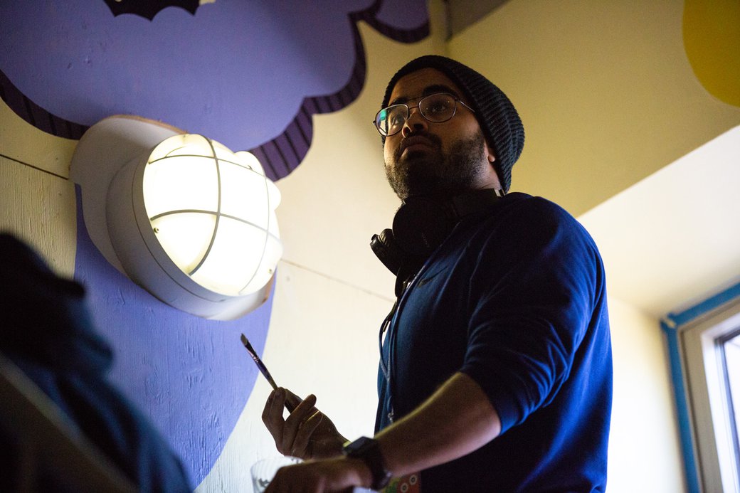 A students works on a mural at the Children's Creativity Museum in SF