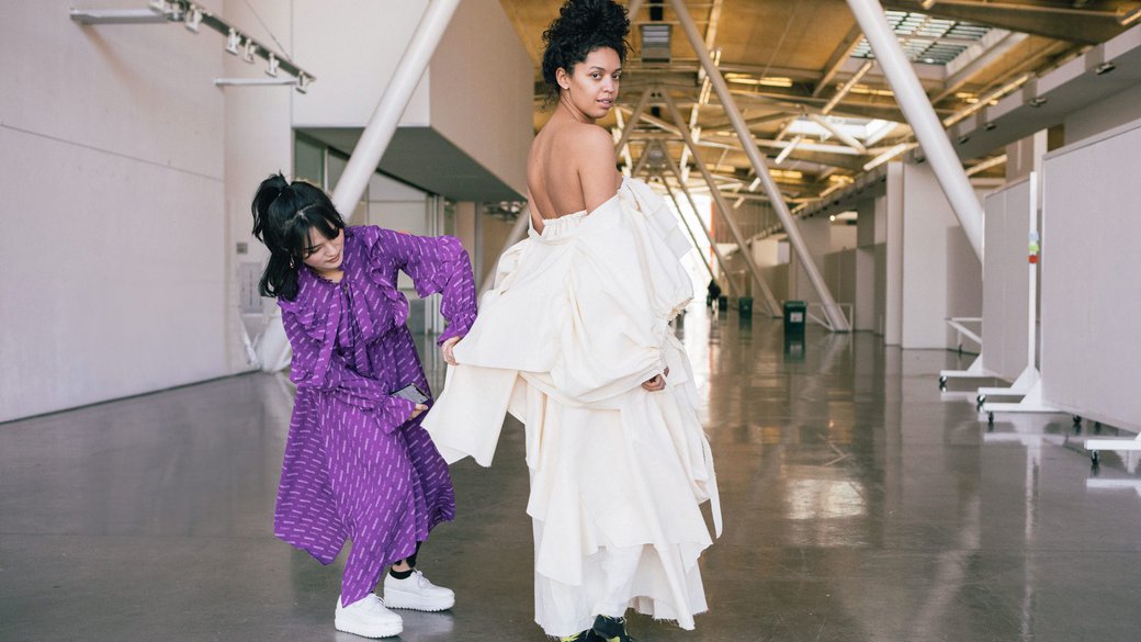 Senior fashion student working with a model in the Nave