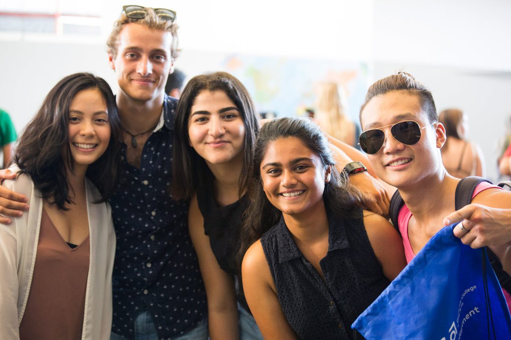 students warmly posing for the camera eye