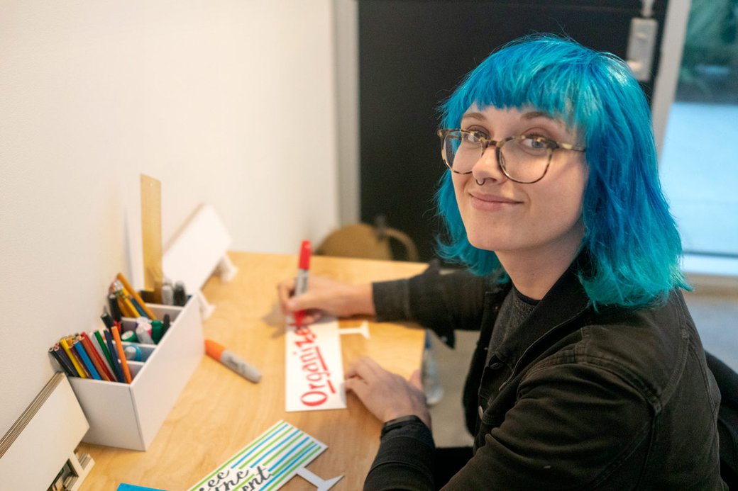 Student at "Take Action / A For Liberties Exhibition at Hubbell galleries.