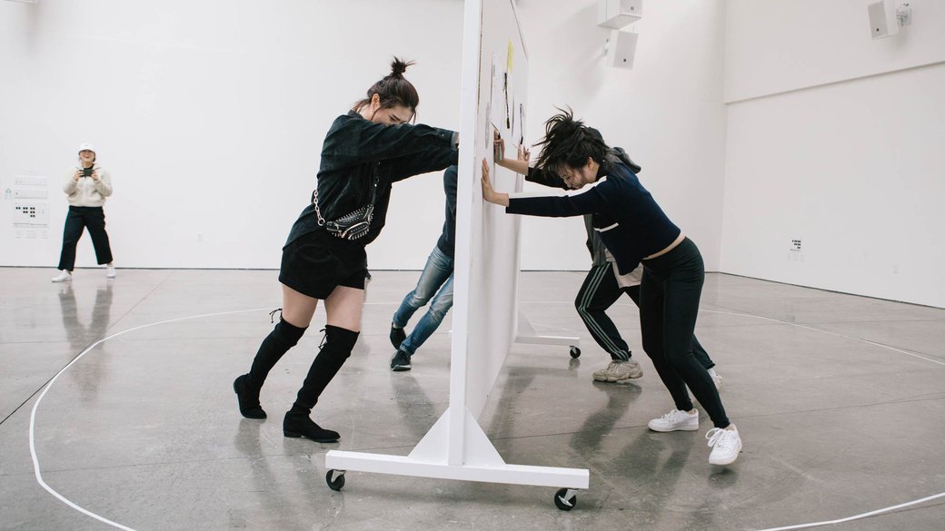 Interdisciplinary class tries to make artwork while moving a drawing board in a circle_feature_MB