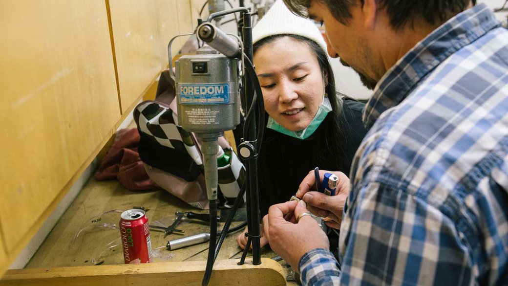 Metalworking student gets help from faculty