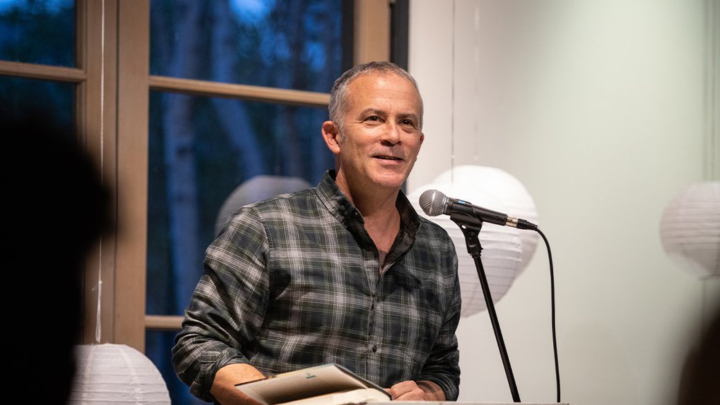 MFA Writing faculty Tom Barbash at podium.