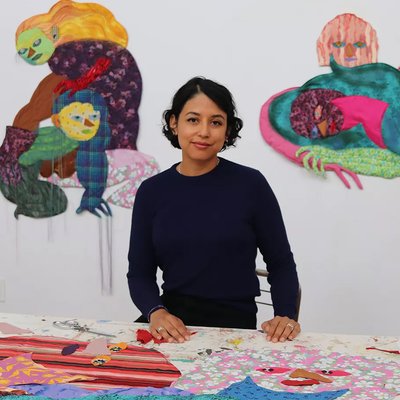 Portrait of Maria A. Guzmán Capron in her studio with her artworks, from left to right, Duo and Siempre, both 2021.